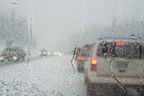 Vehicles moving slow waiting for snow removal on street